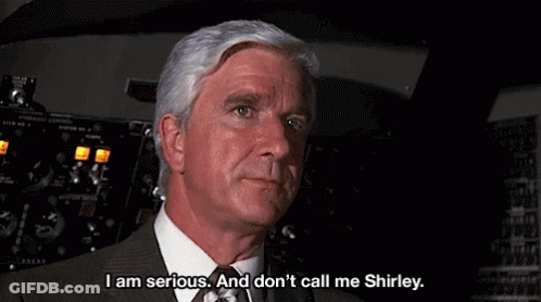 Man In Suit Talking In Cockpit GIF