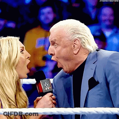 Man In Suit Talking Into Microphone GIF