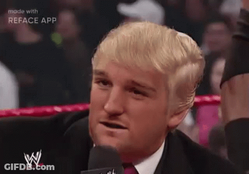 Man In Suit Talking Into Microphone In Ring GIF