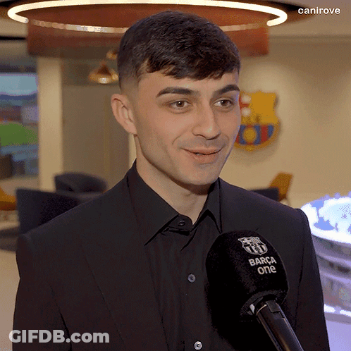 Man In Suit Talking Into Microphone GIF
