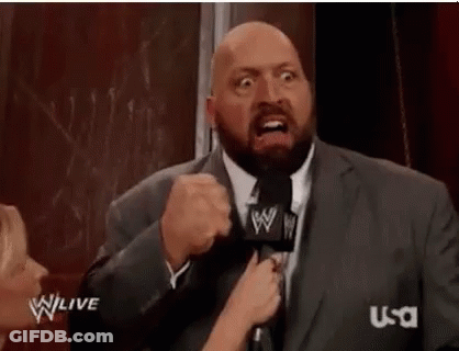 Man In Suit Talking Into Microphone Making Funny Face GIF