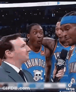 Man In Suit Talking Into Microphone GIF