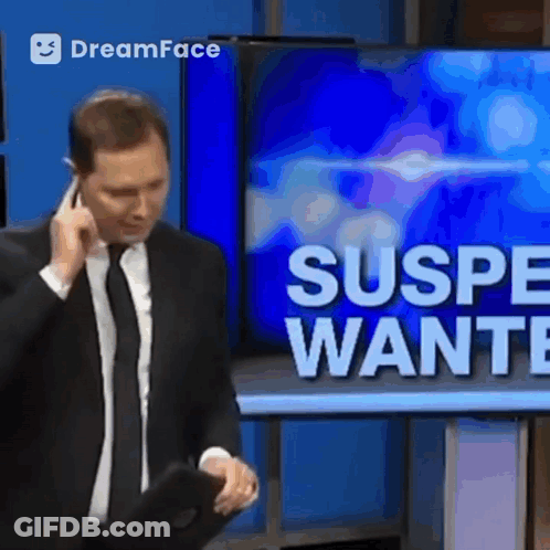 Man In Suit Talking On Cell Phone GIF