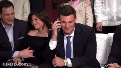 Man In Suit Talking On Cell Phone GIF