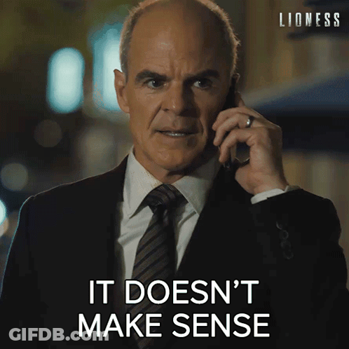 Man In Suit Talking On Cell Phone Saying It Doesn't Make Sense GIF