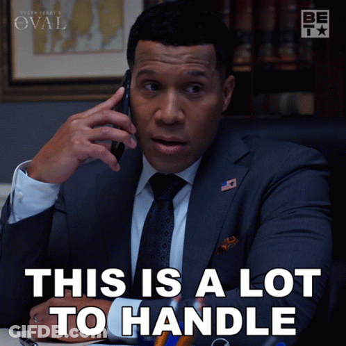 Man In Suit Talking On Cell Phone Saying This Is A Lot To Handle GIF