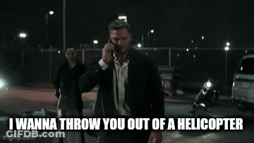 Man In Suit Talking On Cell Phone While Walking GIF