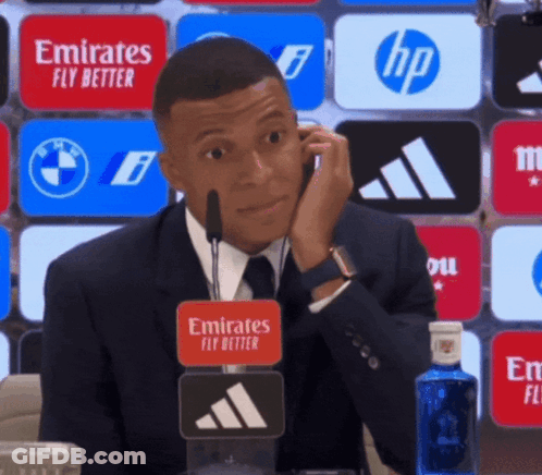 Man In Suit Talking On Cell Phone With Emirates Fly Better Sticker GIF