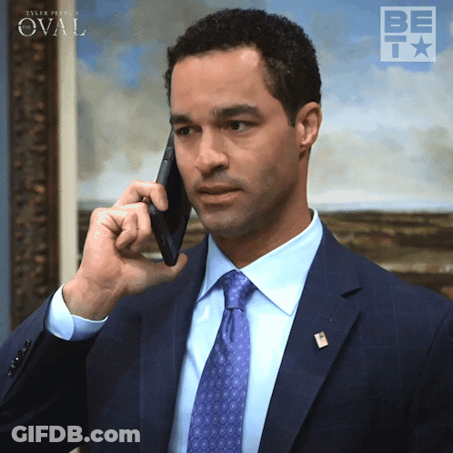 Man In Suit Talking On Cell Phone With Oval Background GIF