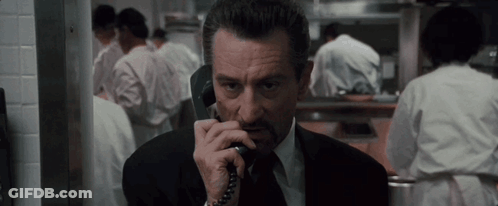 Man In Suit Talking On Phone GIF