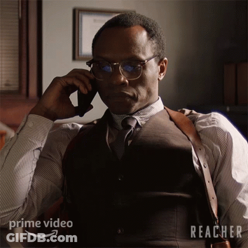Man In Suit Talking On Phone GIF