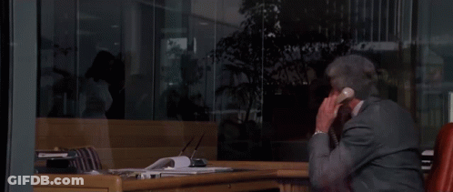 Man In Suit Talking On Phone GIF