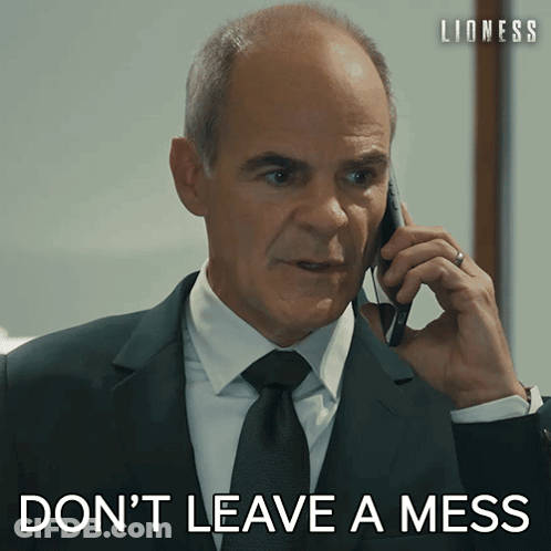 Man In Suit Talking On Phone Don't Leave A Mess GIF