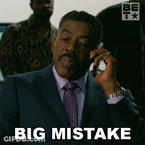 Man In Suit Talking On Phone Saying Big Mistake GIF