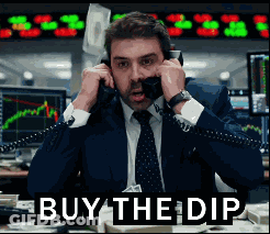 Man In Suit Talking On Phone Saying Buy The Dip GIF