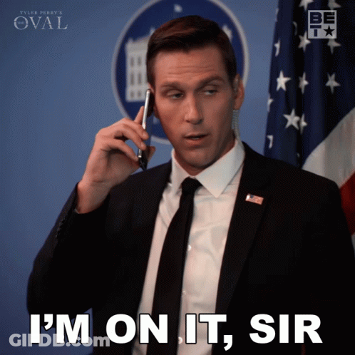 Man In Suit Talking On Phone Saying I'm On It Sir GIF