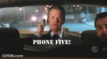 Man In Suit Talking On Phone While Driving GIF