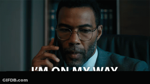 Man In Suit Talking On Phone GIF