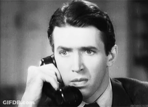 Man In Suit Talking On Telephone GIF