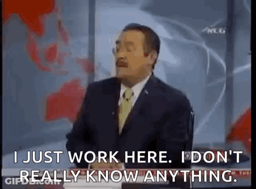 Man In Suit Talking On Television GIF