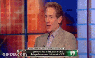 Man In Suit Talking On TV GIF