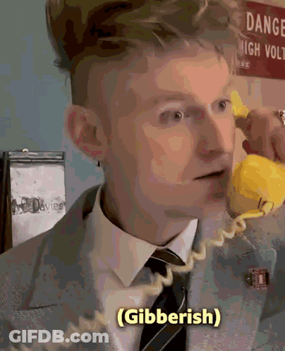 Man In Suit Talking On Yellow Phone GIF
