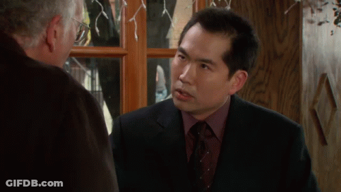Man In Suit Talking To Another Man GIF