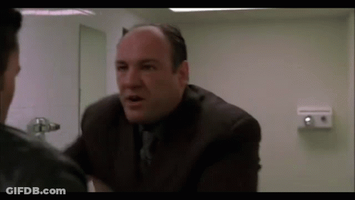 Man In Suit Talking To Another Man GIF
