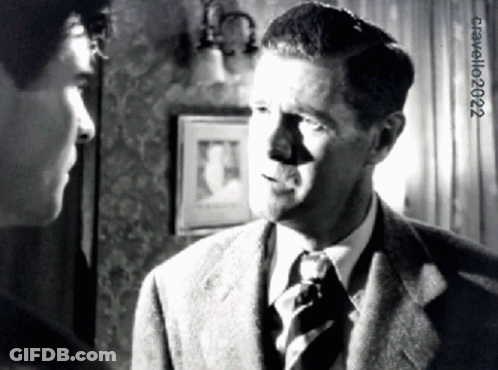 Man In Suit Talking To Another Man GIF