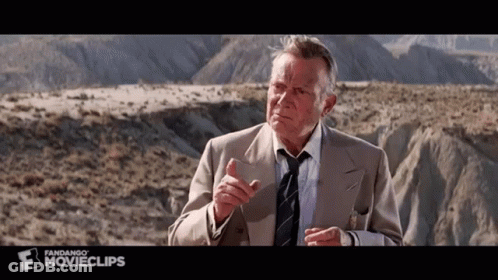 Man In Suit Talking To Another Man GIF