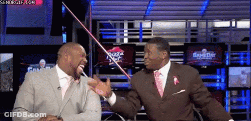 Man In Suit Talking To Another Man By Pizza Hut Sign GIF