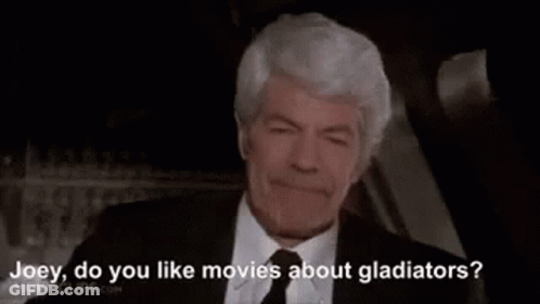 Man In Suit Talking To Another Man GIF