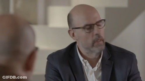Man In Suit Talking To Another Man GIF