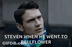 Man In Suit Talking To Another Man In Dark Room GIF