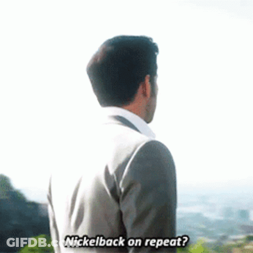 Man In Suit Talking To Another Man In Front Of Mountain GIF