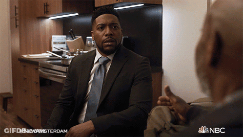 Man In Suit Talking To Another Man In Kitchen NBC GIF