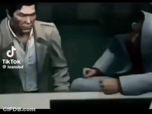 Man In Suit Talking To Another Man In Video Game GIF