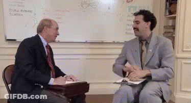 Man In Suit Talking To Another Man GIF