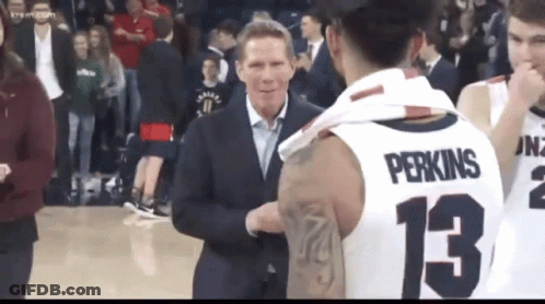 Man In Suit Talking To Basketball Player 13 GIF