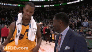 Man In Suit Talking To Basketball Player GIF