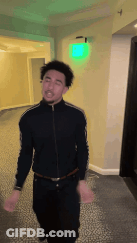 Man In Suit Talking To Basketball Player Number 3 GIF