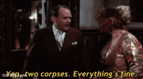Man In Suit Talking To Blood-Covered Woman In Dress GIF