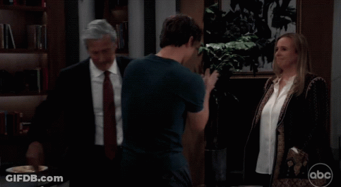 Man In Suit Talking To Boy And Woman With ABC GIF
