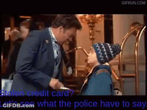 Man In Suit Talking To Boy In Beanie Holding Credit Card GIF