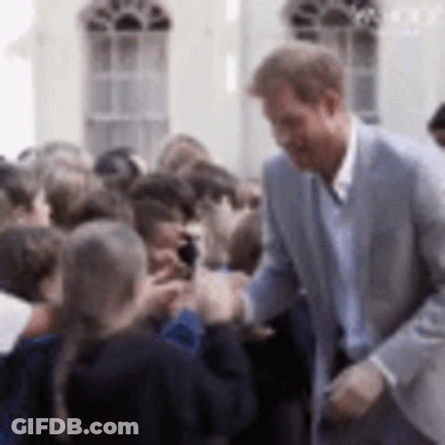 Man In Suit Talking To Group GIF