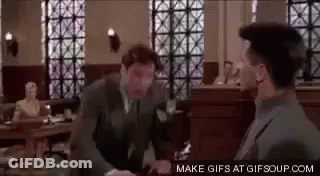 Man In Suit Talking To Man GIF