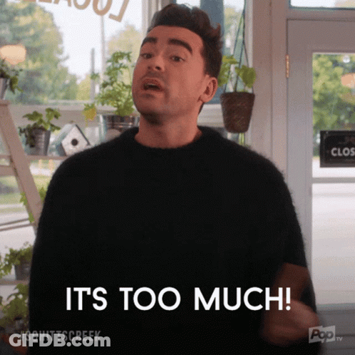 Man In Suit Talking To Man In Blue Shirt GIF