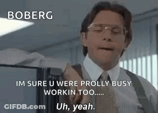 Man In Suit Talking To Man In Cubicle GIF