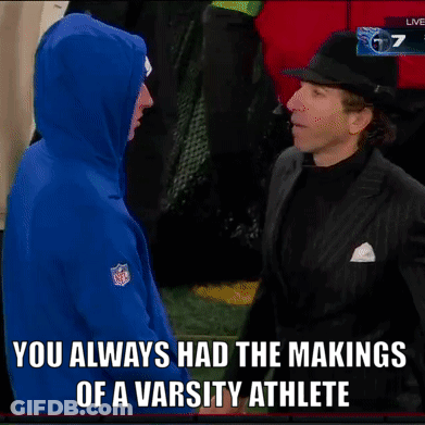 Man In Suit Talking To Man In NFL Hoodie GIF