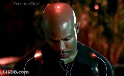 Man In Suit Talking To Man In Plaid Shirt GIF